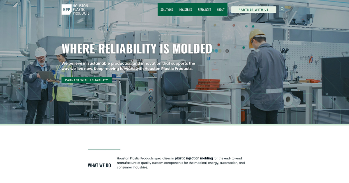 A professional website header for Houston Plastic Products with the tagline 'WHERE RELIABILITY IS MOLDED'. It features a high-resolution image of a clean, modern plastic manufacturing facility with employees engaged in work. One is consulting a digital tablet with a colleague, emphasizing teamwork and technology in their operations. The webpage communicates Houston Plastic Products' commitment to sustainable production and innovation in the plastic injection molding industry, targeting medical, energy, automation, and consumer sectors.