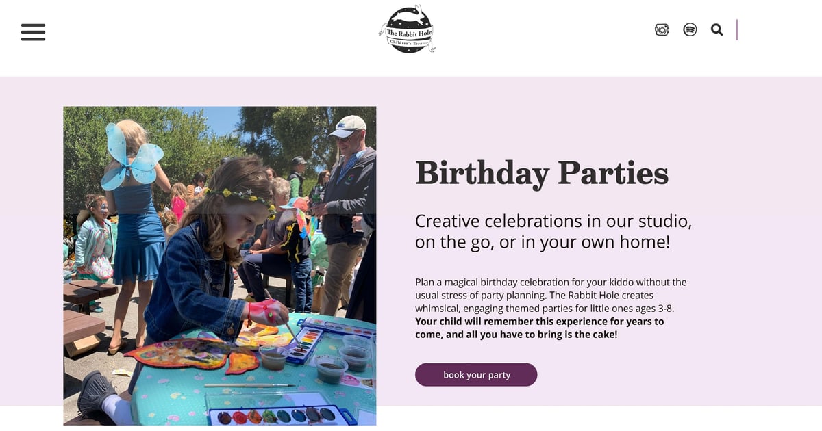 A webpage from The Rabbit Hole Children's Theater features information about organizing Birthday Parties. It showcases a photo of children engaging in outdoor activities; one child, wearing blue fairy wings, focuses on painting, surrounded by other attendees in a sunny, park setting. The text highlights 'Creative celebrations in our studio, on the go, or in your own home', emphasizing hassle-free, magical birthday celebrations for kids ages 3-8. A 'book your party' call-to-action button invites further engagement.