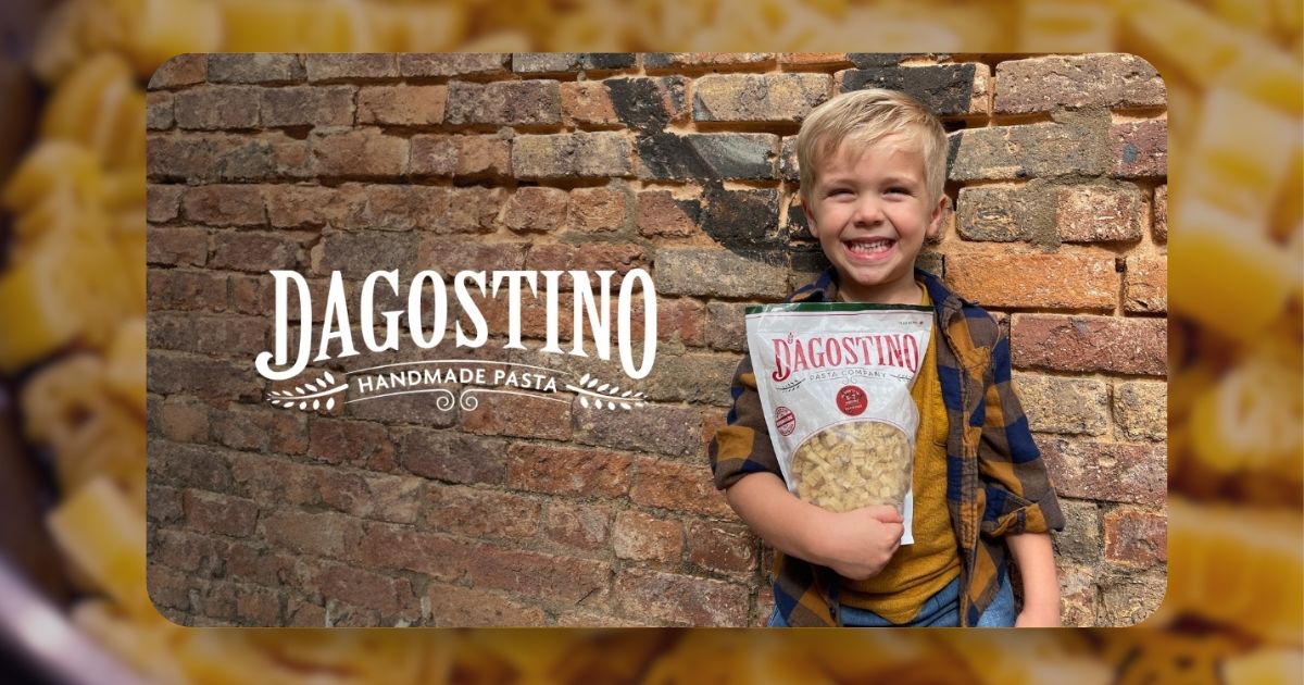 Child holding a bag of Dagostino Pasta with the updated packaging design, showcasing the fusion of tradition and modernity.